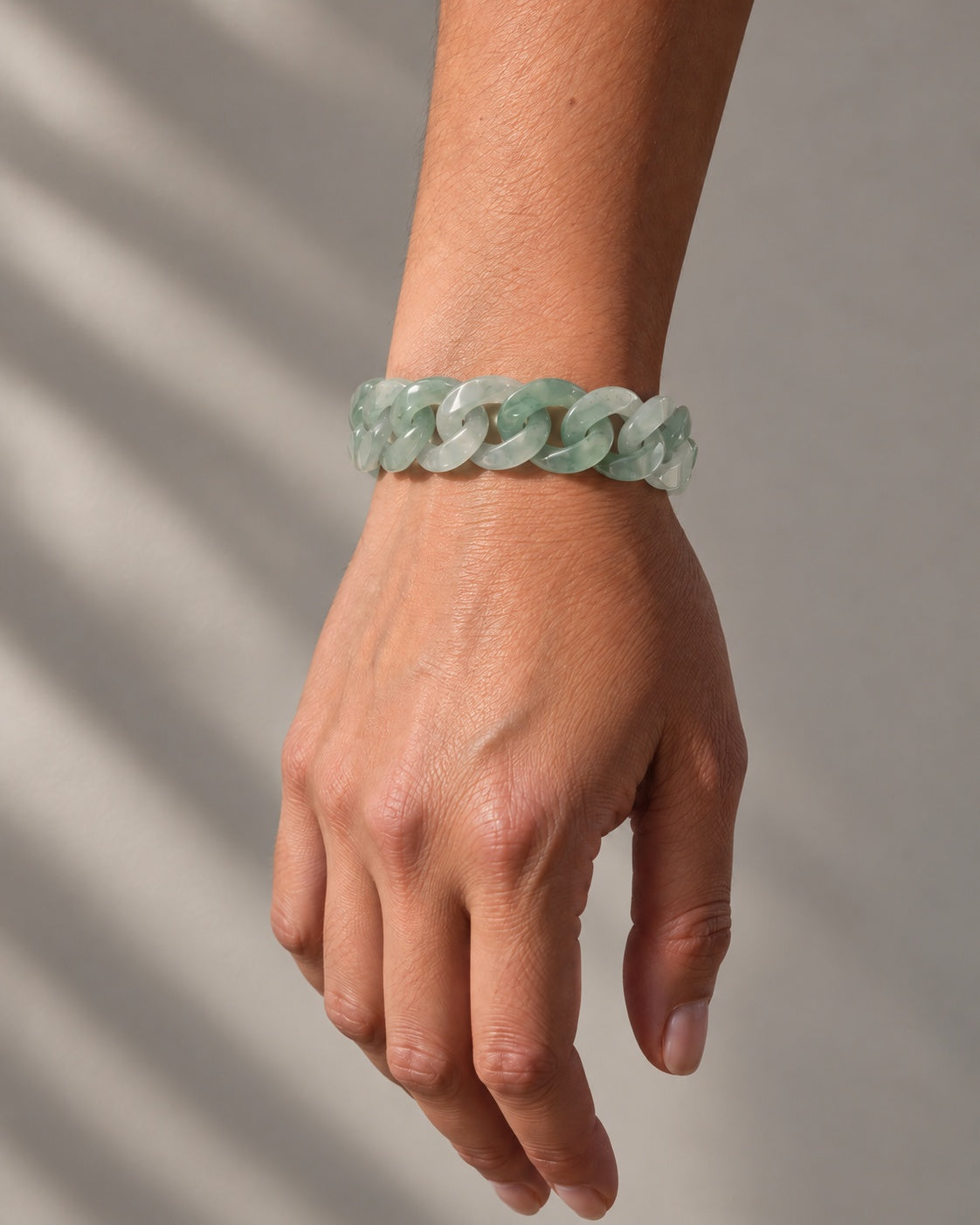 Classic Cuban Link Chain Bracelet In Light Green African Jade worn on the wrist