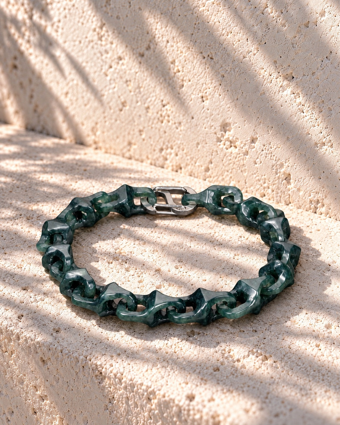 Dragon Spine Bracelet In Dark Green Mayan Jade on pale stone