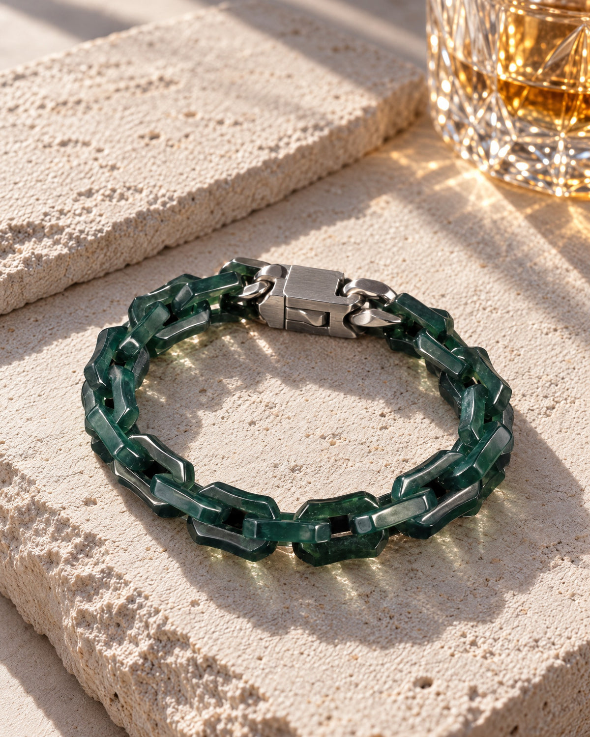 Chunky Square Cable Chain Bracelet In Mayan Jade on pale limestone in warm sunlight