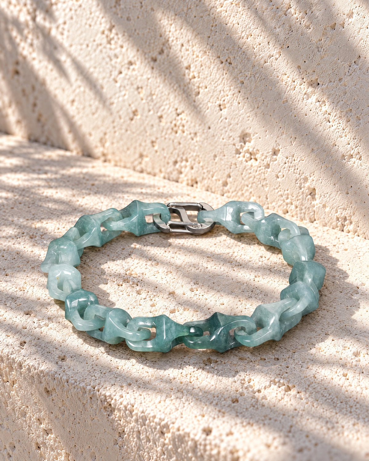 Dragon Spine Bracelet In Mayan Blue Jade on pale limestone in warm sunlight