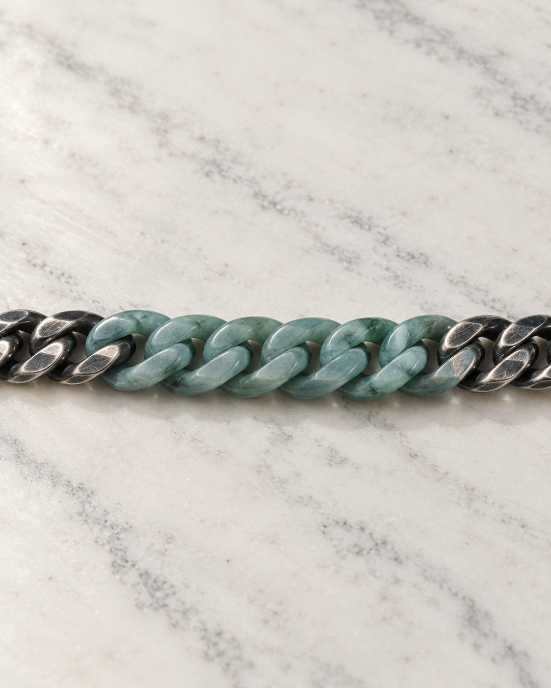Classic Cuban Chain Bracelet In Green Jade With Oxidized Stainless Steel on white stone: marble tabletop detail — 8mm