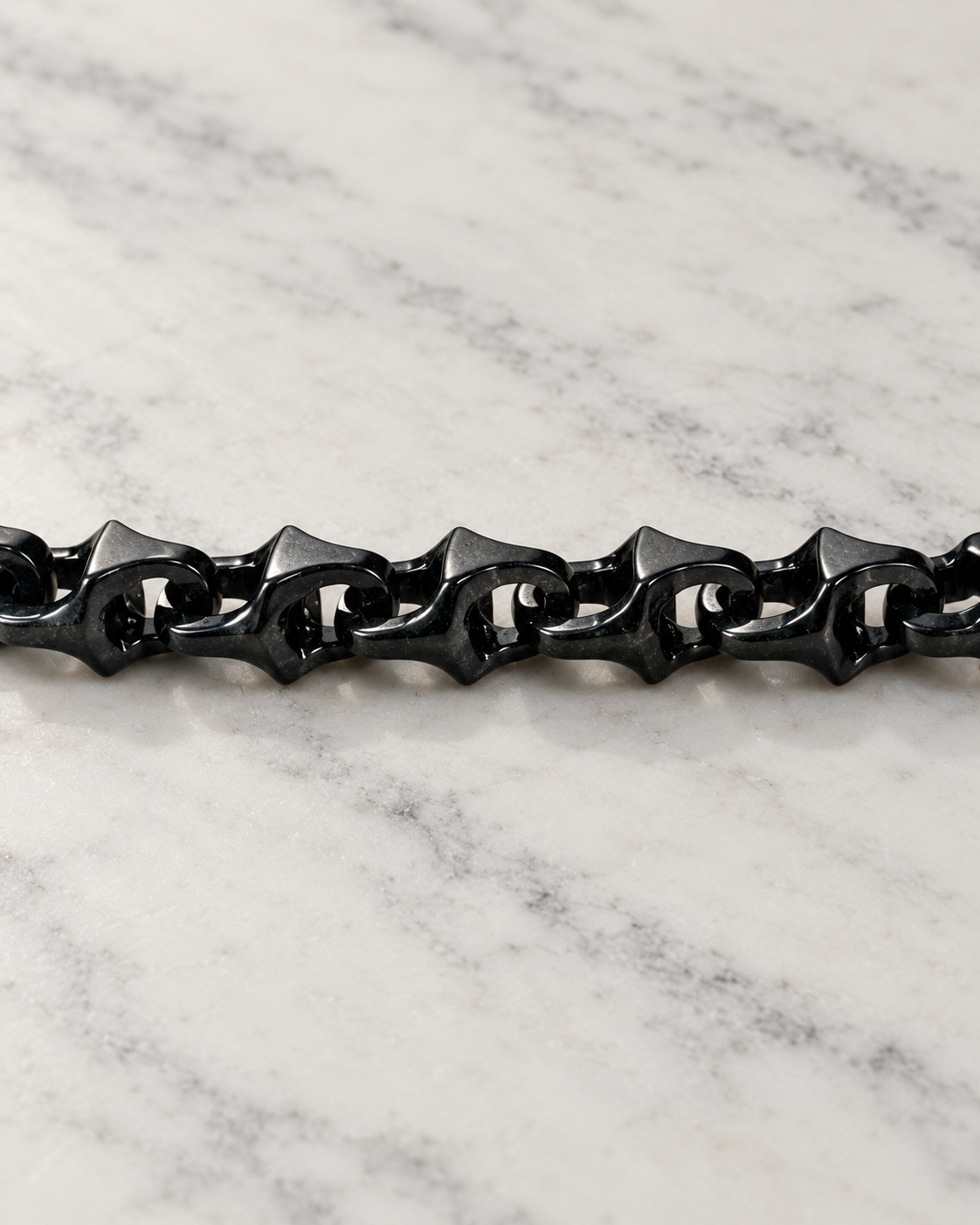 Dragon Spine Bracelet In Black Mayan Jade on white stone: marble tabletop detail