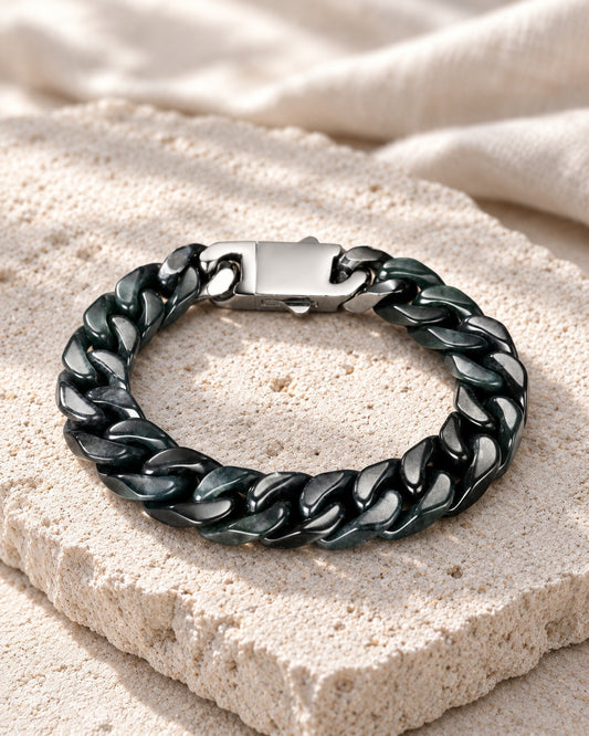 Classic Cuban Link Chain Bracelet In Black Jade on white stone: Angled limestone slab