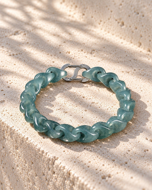Single Piece Carved Dragon Spine Cable Chain Bracelet In Mayan Jade on white stone: White stone edge