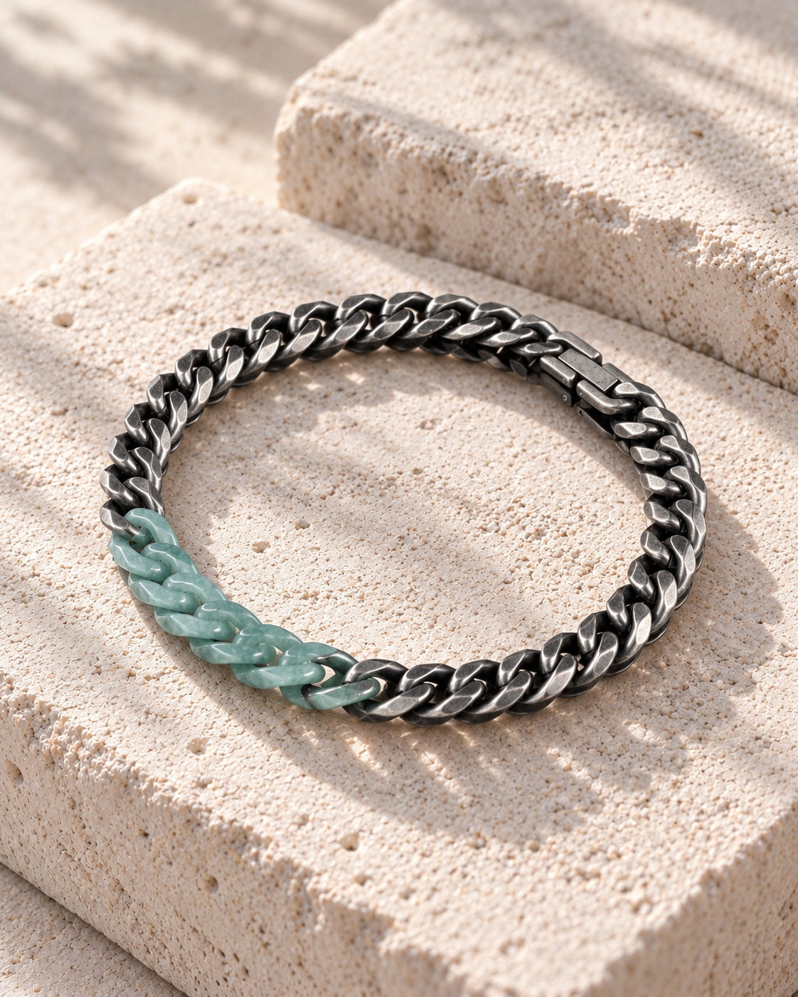 Classic Cuban Chain Bracelet In Green Jade With Oxidized Stainless Steel on white stone: Offset white stone blocks