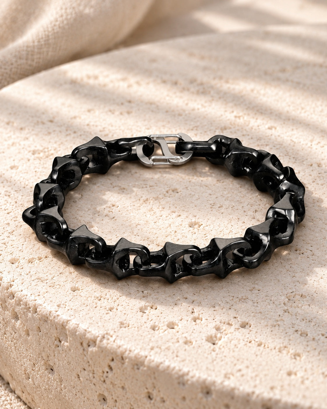 Dragon Spine Bracelet In Black Mayan Jade on white stone: Soft curved stone surface