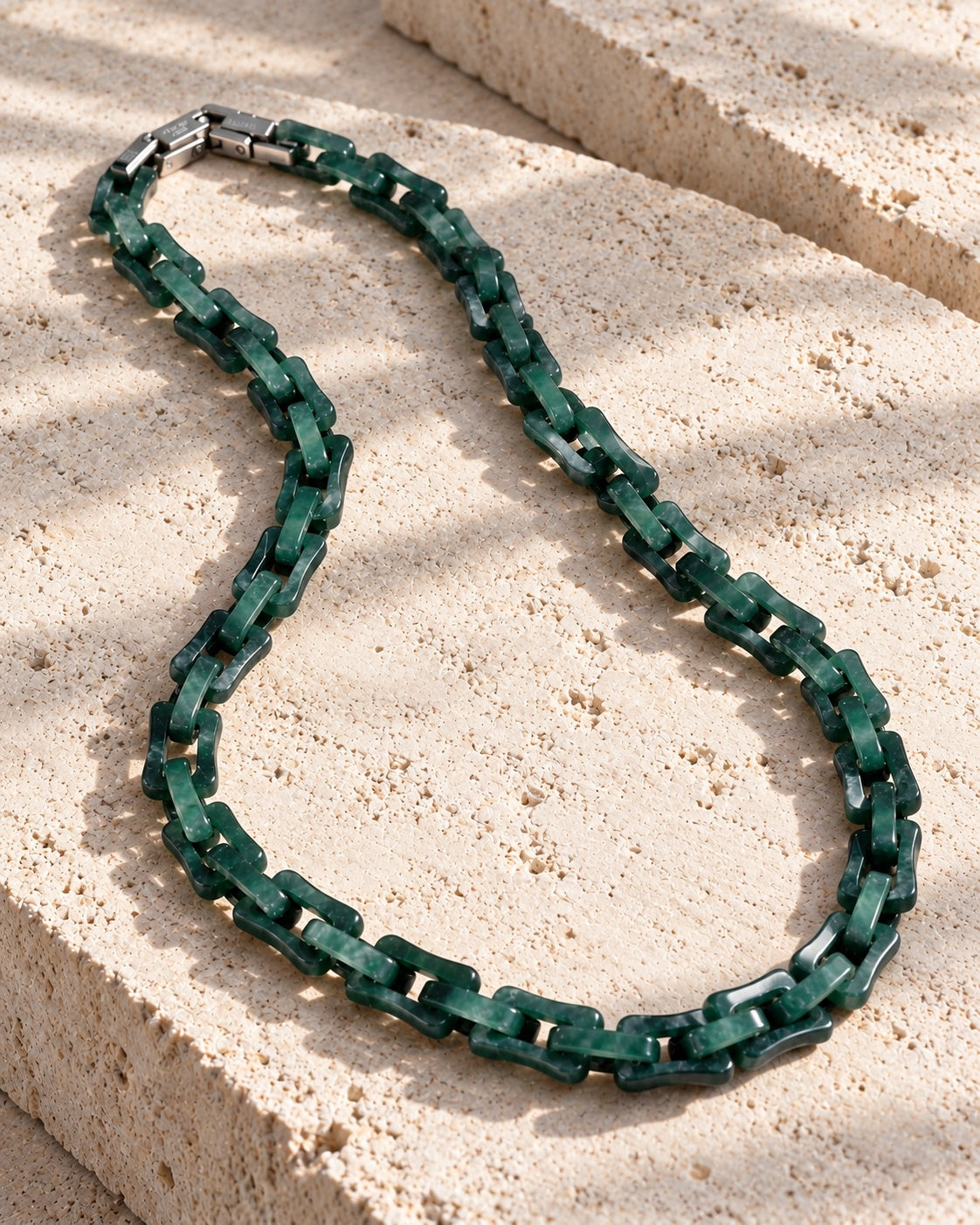 Square Cable Chain Necklace In Dark Green Mayan Jade on white stone: Offset white stone blocks